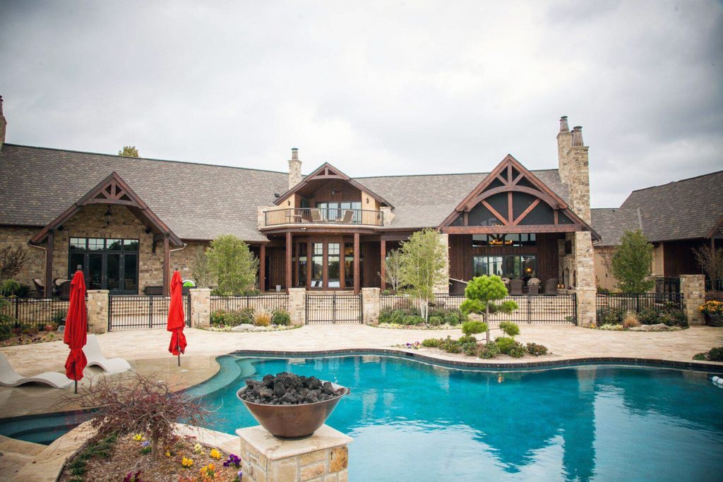 ranch style home with wood windows